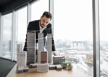 A man in an office attire showing construction service Architecture.