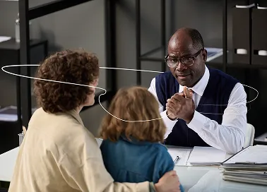 Two coworkers in an office building.