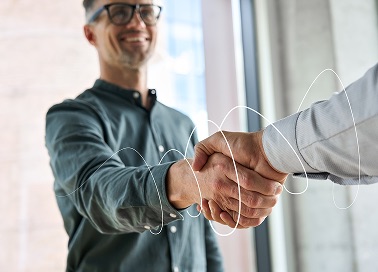two persons shaking their hands for sales