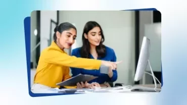 Promotional tile from Talent Trends 2026 featuring two women pointing at a computer screen