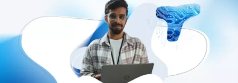 Man with dark hair and glasses on his computer 