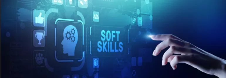 Hand reaching towards digital icons and 'Soft Skills' text on a virtual interface.