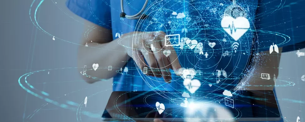 A person in scrubs interacts with a digital interface displaying medical icons and data.