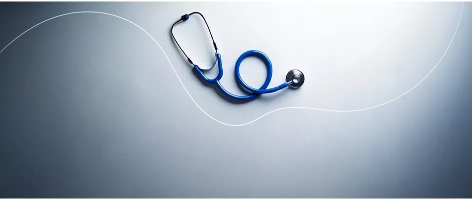 A stethoscope with a gray background demonstrating healthcare.